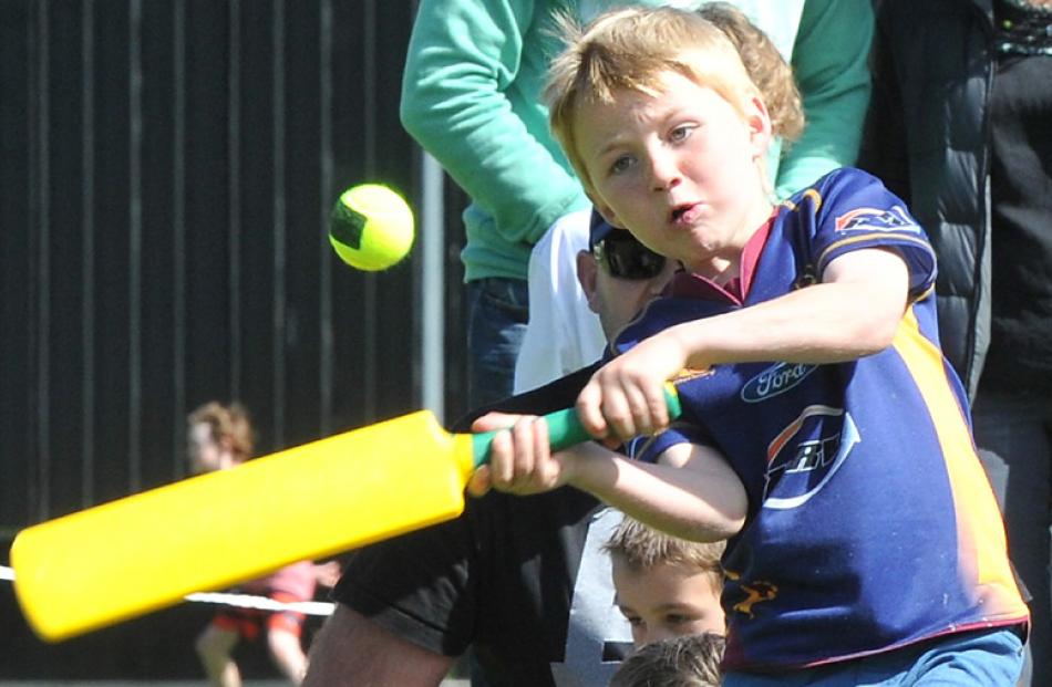 Alex Piebenga (7), of Dunedin, sends a tennis ball to the boundary.