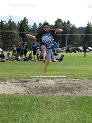 Max Caulton (8), of Remarkables Primary School, competes in the long jump.