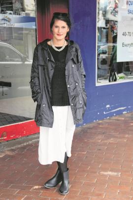 Rebekah wears a Something Else sweater from Belle Bird, Top-Shop dress, Melissa boots and a...