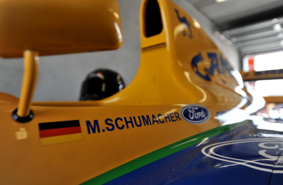 One of Formula One's greats sat here: Michael Shumacher's Benneton F1 car on display in the pit...