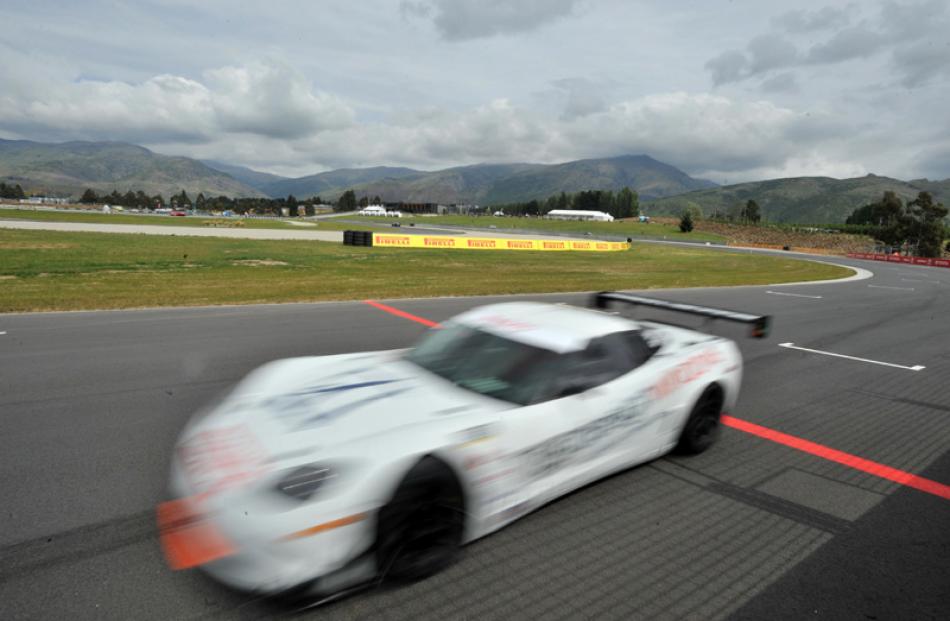 A Corvette from the Australian GT series passes pit lane during practice.