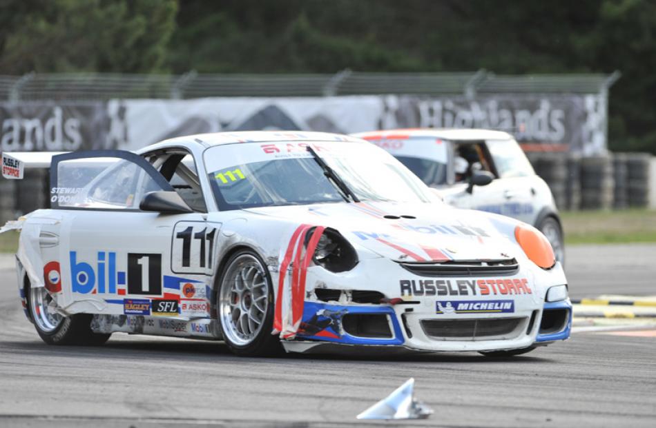 Bruce Stewart, from Christchurch, driving a Porsche, had a bit of trouble with a door that kept...