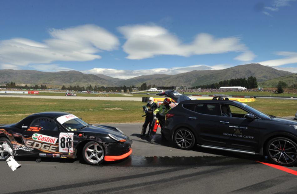 Car number 86, a Porsche Boxster, driven by George Randle, is in a sorry state after crashing...
