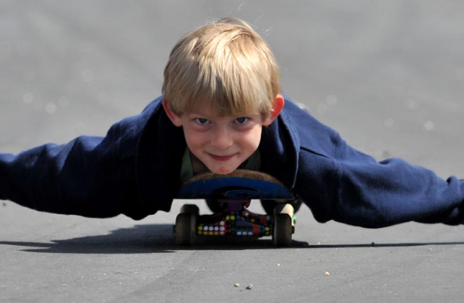 Ryder McGuigan (8), from Christchurch, entertains himself while his dad, a driver, competes.