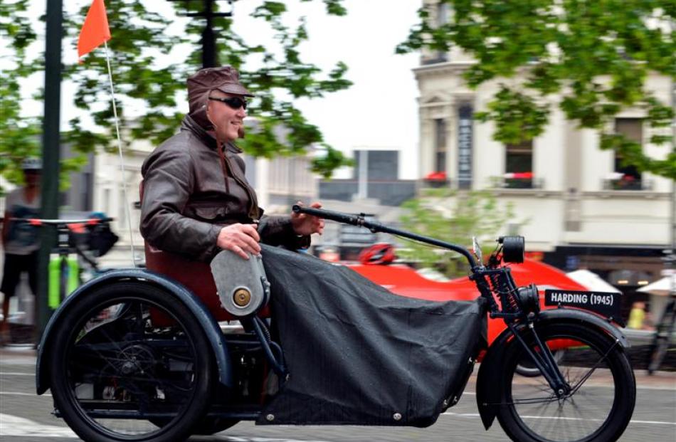 Tony McCarthy drives a 1945 Harding electric invalid carriage in the parade. Photos by Peter...