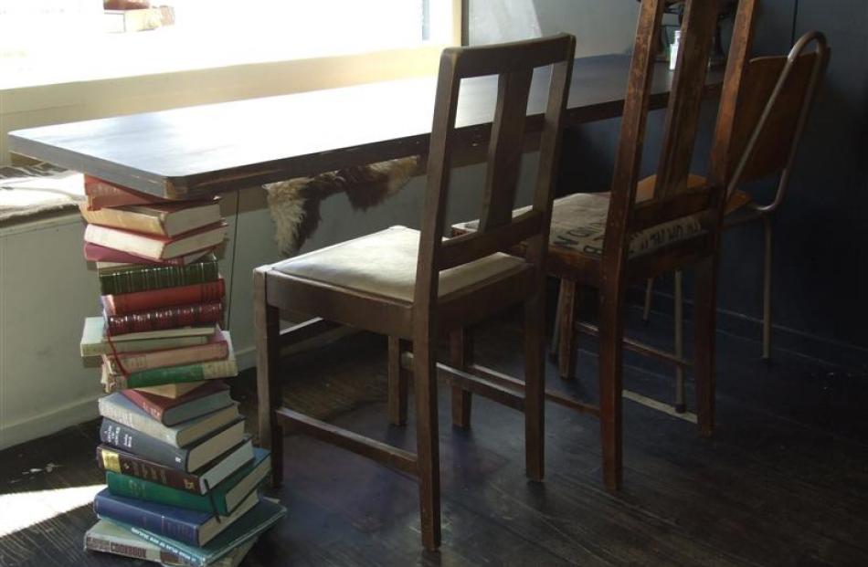 A table leg made from books.