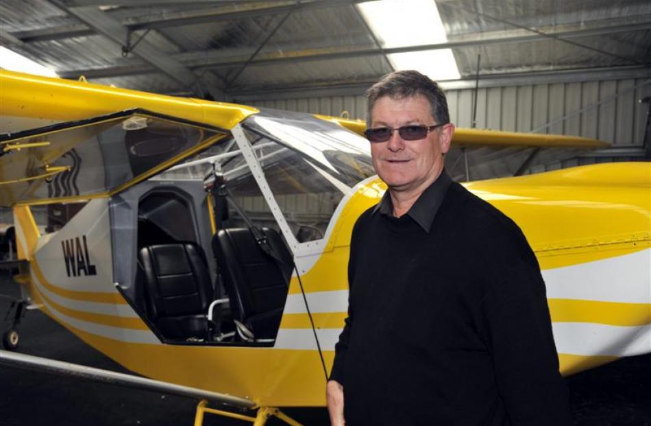 Otago Aero Club president Warwick Sims in front of the RANS S7 he half owns.