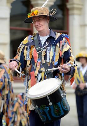 Alan Carlyle, of Christchurch, keeps the beat for a troupe of morris dancers.