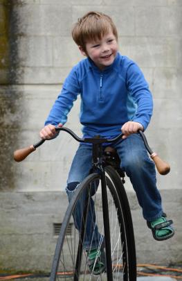 Stanley Hillman (5), of Dunedin, tries a penny farthing for size.