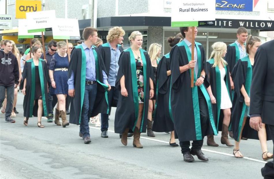 Telford graduands walk down Clyde St during the Telford graduation parade in Balclutha yesterday.