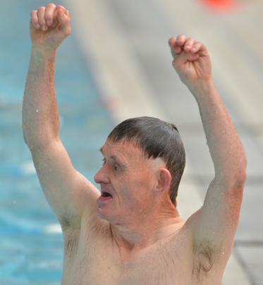 Davin Johnson celebrates his win in the 15 metre unassisted swim.