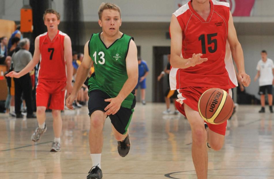 Luke McDonald, from Allendale High School, dribbles the ball to the hoop at the Edgar Centre with...