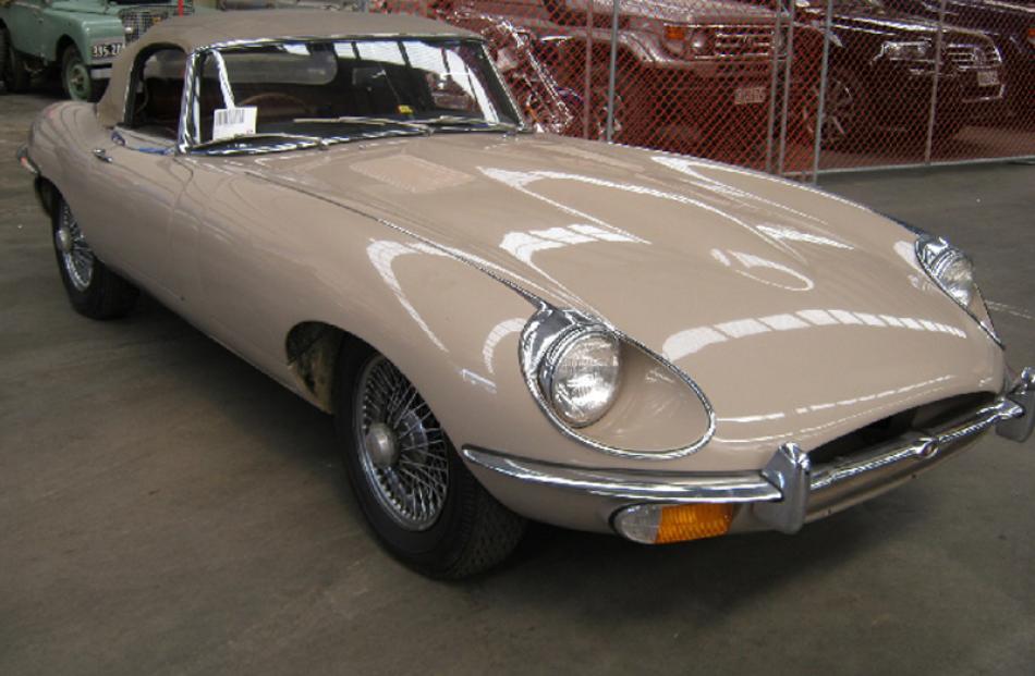 Jaguar E-Type V-12, bought for $75,000, sold for $53,000.
