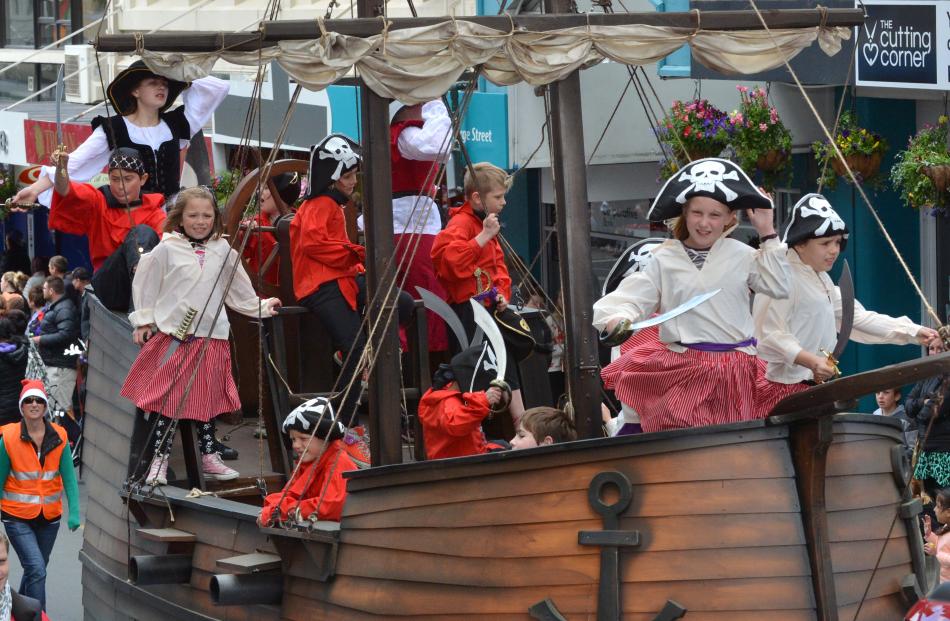 A pirate ship navigates the blustery conditions in George St.