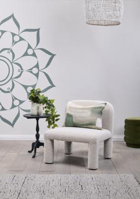 This room’s minimalist backdrop is beautified by a mandala mural — a geometric design that’s a...