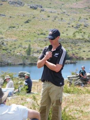 Duncan Campbell speaks during a lunch break to the about 300 people who attended a field day at...
