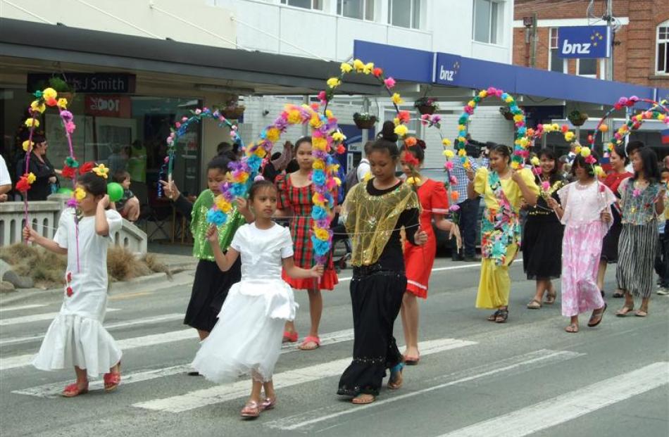 Members of the Clutha Filipino community take part in the Christmas parade in Balclutha on Saturday.