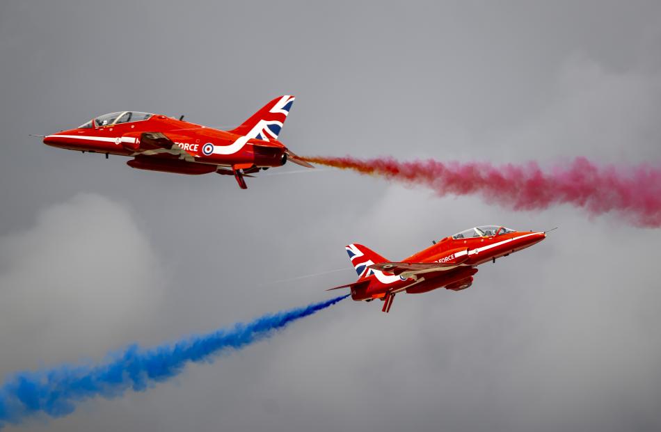 The Red Arrows perform at RAF Fairford during the Royal Military Air Tattoo in Fairford, England....