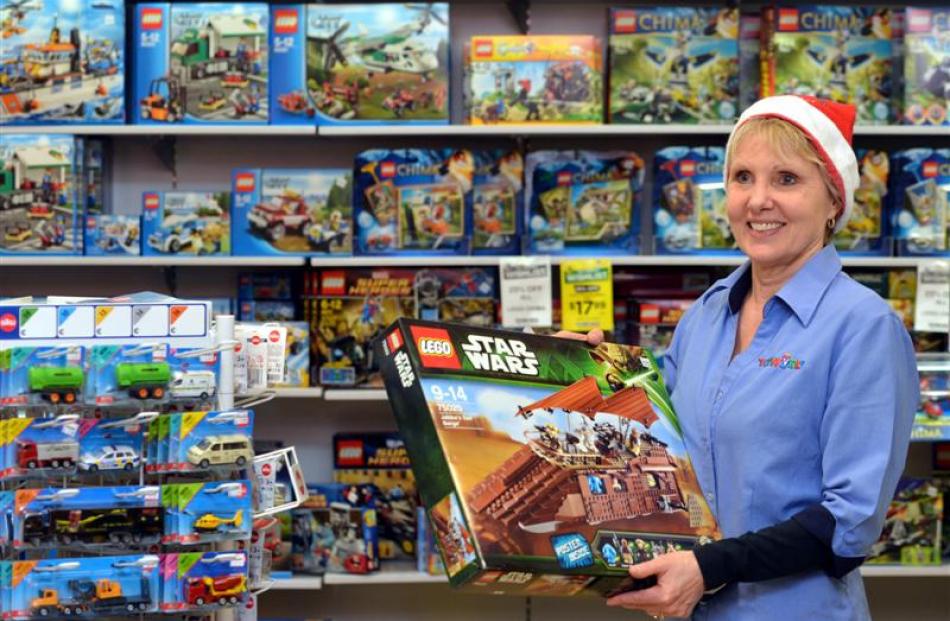 Toy World Dunedin branch owner Linda Verity holds a box of Lego, which  like in other years has...