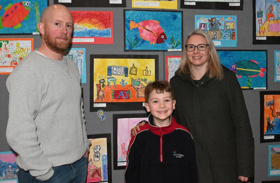 Exhibitor Arlo Horan, 7, of Grants Braes School, with his parents John Horan and Esther Wells.