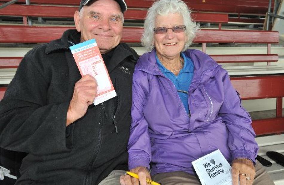 Bryan (67) and Lynne Osborne (64), of Snells Beach, watch the Wingatui Boxing Day race from the...