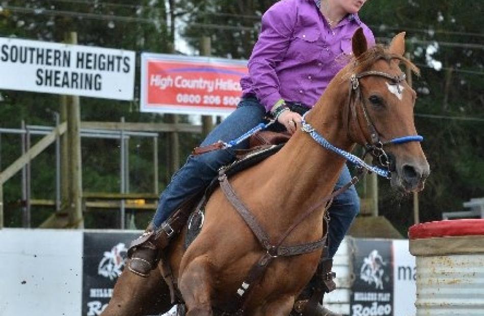 Micayla Brensell, of Oamaru, rounds the mark in the 2nd division barrel race yesterday.