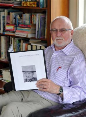 Retired schoolteacher Alan Jackson holds a photo of Archibald Baxter. Photo by Craig Baxter.