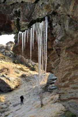 Icicles hang from a rock buttress above a man-made dam on Bendigo station.