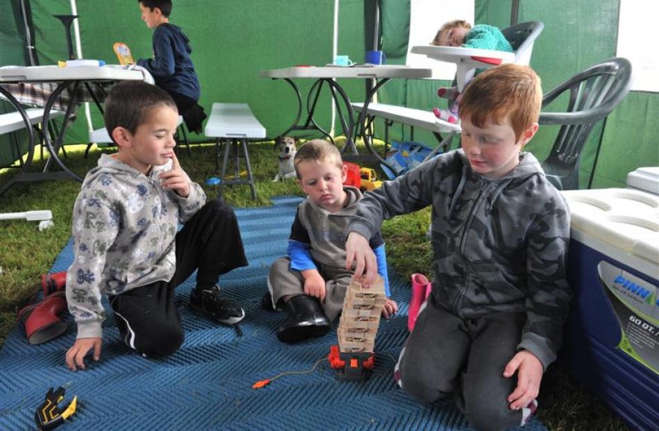 Cousins (from left) Taiaroa Rolton (6), Sonny Rolton (2) and Kain Thomas (7) play with Jenga...