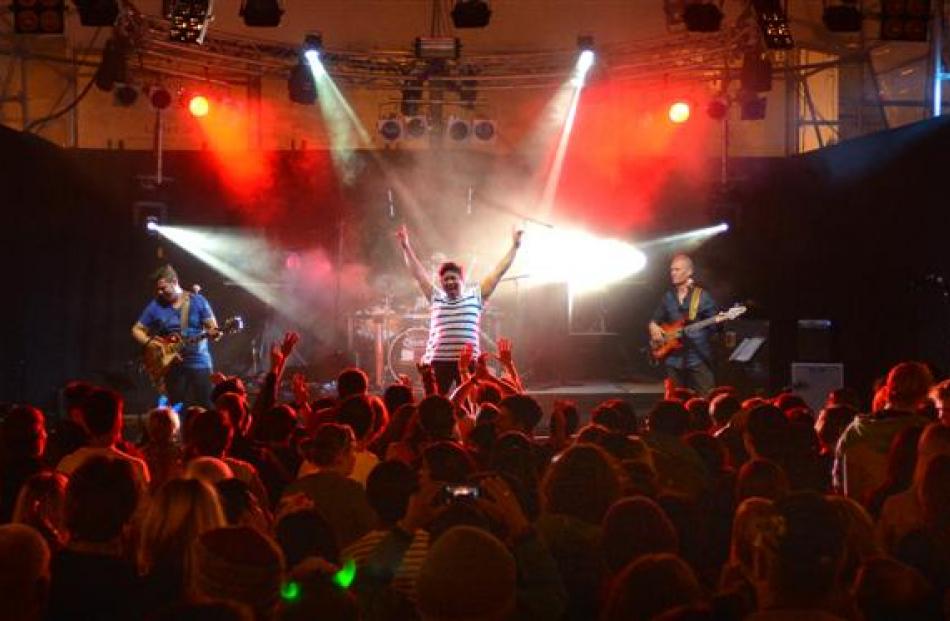 Cougar Zoo, of Dunedin, entertain the thousands of people at the Octagon. Photo by Peter McIntosh.