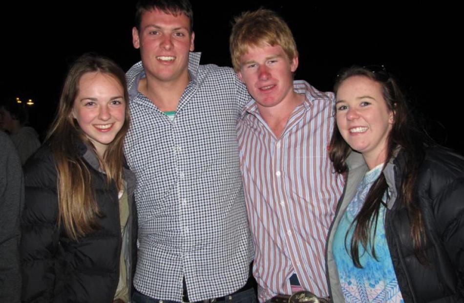 Waiting to see in 2014 among the crowd on the Wanaka lakefront are (from left) Erin Fleming, of...