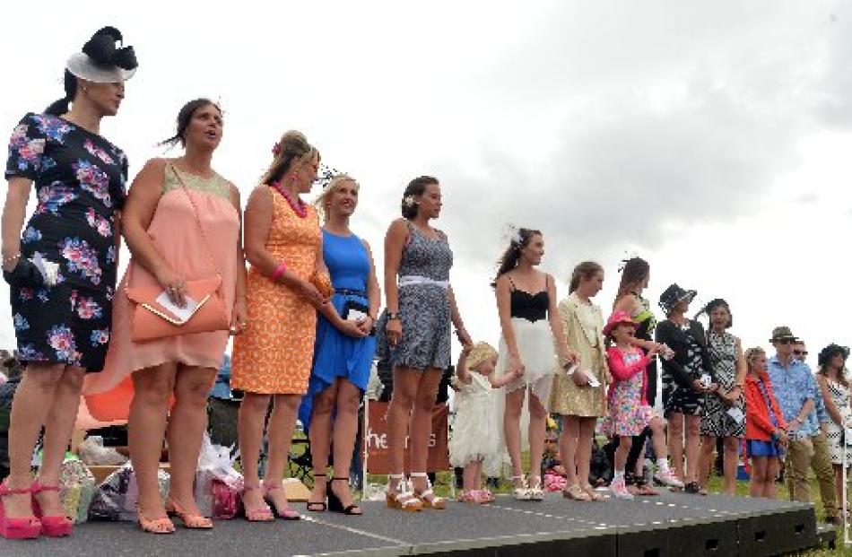 Fashions on  the Field contestants line up on the catwalk.
