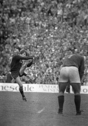 All Black fullback Allan Hewson kicks the winning penalty against South Africa at Eden Park in...