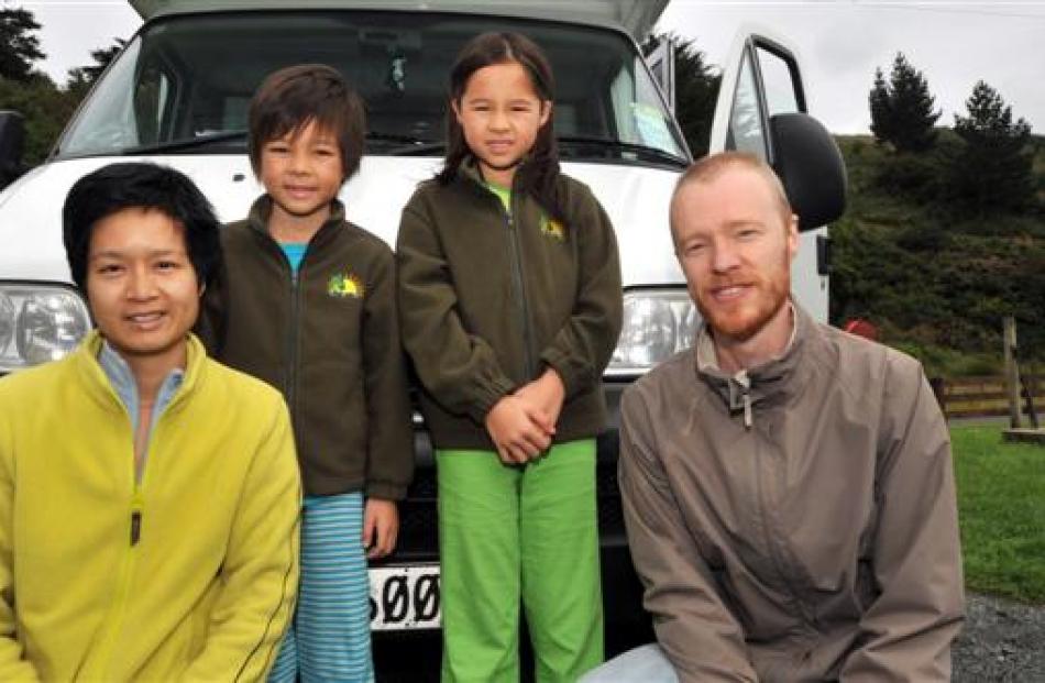Tourists (from left) Josephine (40), Orin (7), Aoife (9) and Dhugal Meachem (41), of Hong Kong,...