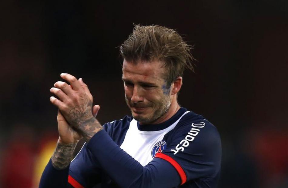 Football great  David Beckham breaks down in tears as he leaves the pitch after being substituted...