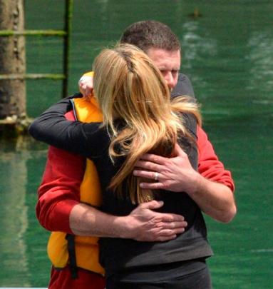 The skipper and owner of a boat which capsized off Otago Peninsula yesterday, John King, embraces...