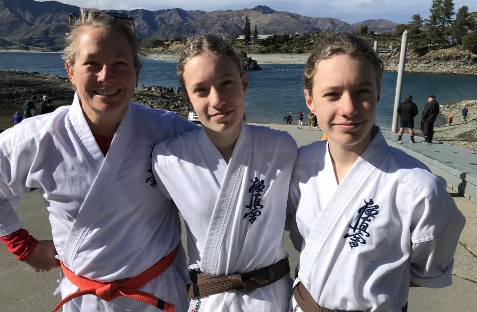 Lake Hāwea Karate Club members Kaz Smith with her twin daughters Mackenzie and Olivia, 12.