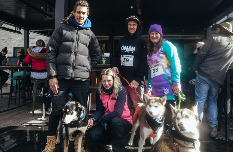 Simon Evans, with dog Olly, Monika Volanlova, Ben Eagles with dog Luna, and Andrea Eagles with...