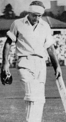 New Zealand batsman Bert Sutcliffe leaves the field, his head bandaged,  after scoring 80 not out...