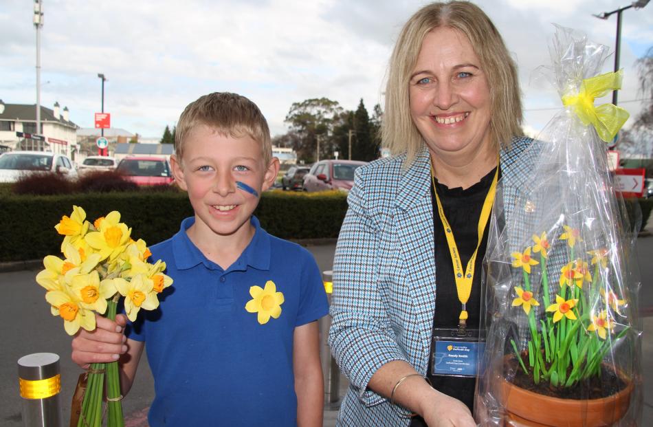 Toby Welsh, 10, of Mandeville bought some daffodils to support the Cancer Society of New Zealand...