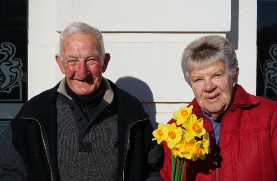 Mervyn and Hazel Roper hold some of the flowers they sold for Daffodil Day in Oamaru. PHOTO:...