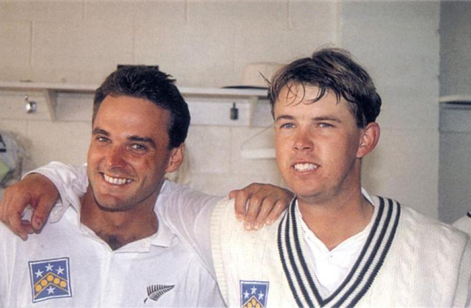 Bryan Young (left) and Shane Thomson celebrate scoring maiden test centuries and guiding New...