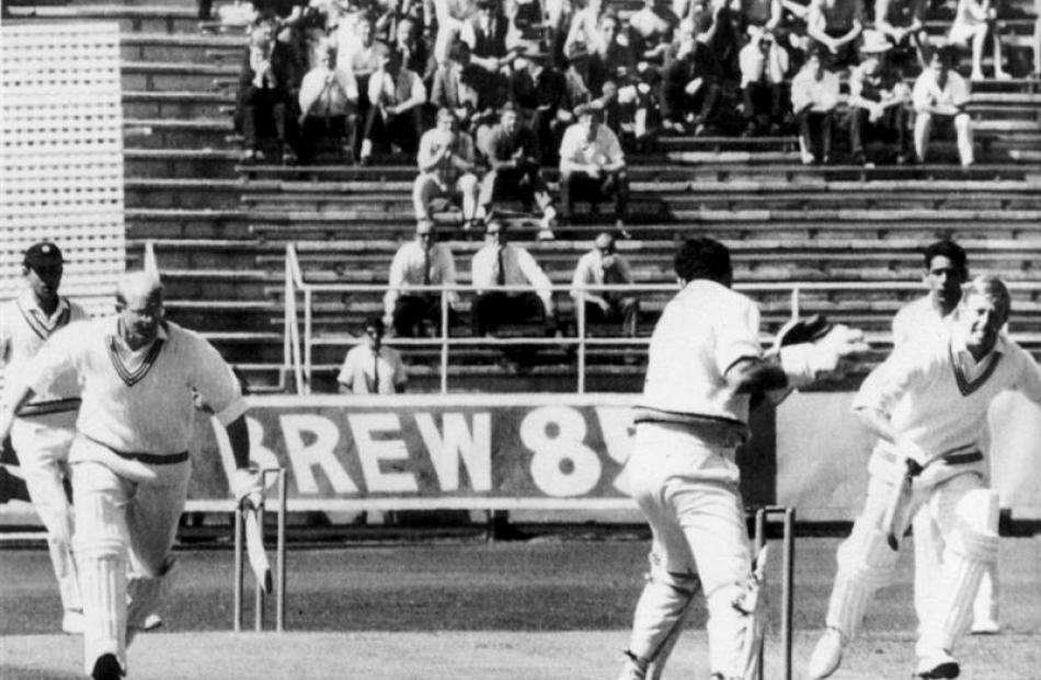 Indian wicketkeeper Farokh Engineer breaks the wickets with  Bryan Yuile (left)  and Mark Burgess...