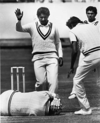 Lance Cairns lies on the ground after being struck on the side of the head by a ball from Wasim...