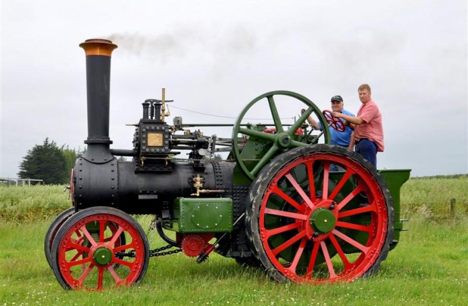 Owen Saunders and his son Brendan ride  the 1911 Burrell traction engine. Photo by Margaret...