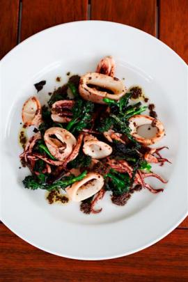 Seared squid with sprouting broccoli and black olive tapenade.