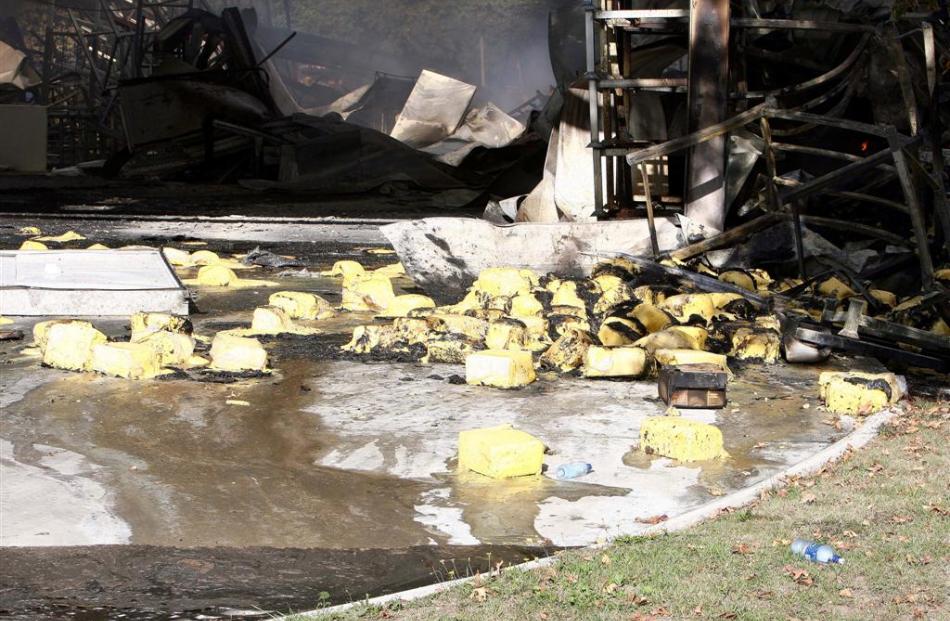 Burnt cheese smoulders the morning after the fire. Photo by NZPA Wayne Drought