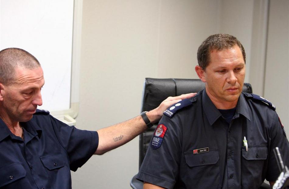 Snr fire fighter Blair Fothergill (left) comforts Snr station officer Blair Trim as he talks...