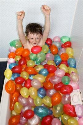Junior Winner: Baths, laughs and balloons - Harry Ross (12) is well prepared for a water balloon...