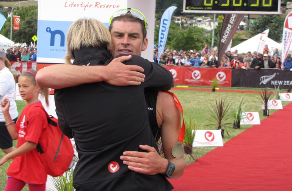 Challenge Wanaka race director Victoria Murray-Orr congratulates winner Dylan McNeice at the...